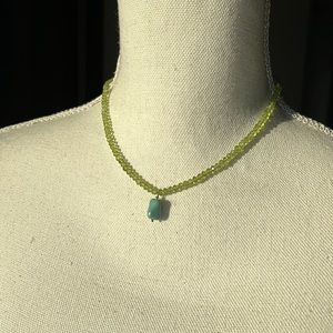Green beaded shirt necklace with turquoise drop
